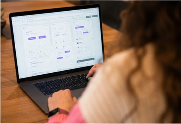 A wireframe layout open on a laptop screen